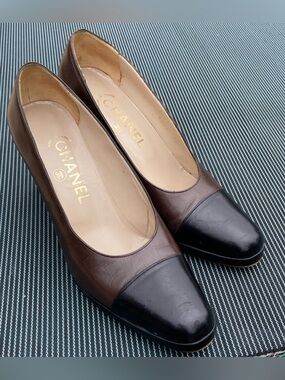 CHANEL Two-Tone Brown and Black Leather Cap-Toe Pumps